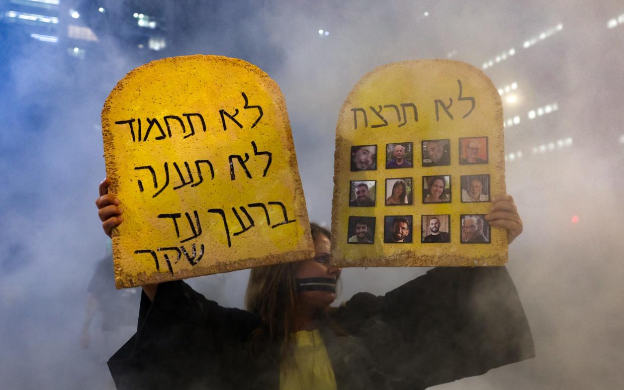 Protesters demonstrate outside the Israeli defence ministry in Tel Aviv on Sept 3