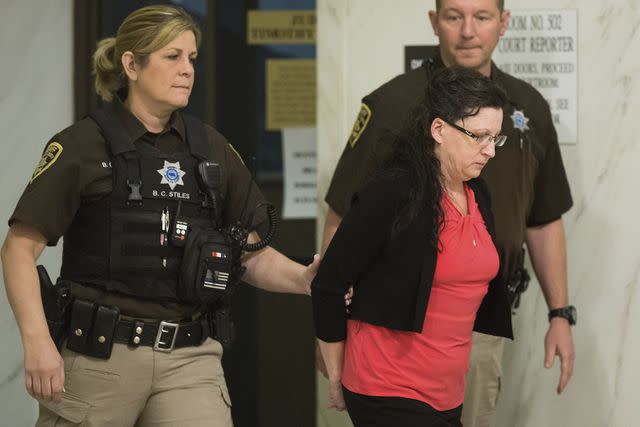 <p>RYAN SODERLIN/THE WORLD-HERALD</p> Lover, Stalker, Killer Shanna Golyar is lead out of Judge Timothy Burn's courtroom on Wednesday, May 10, 2017