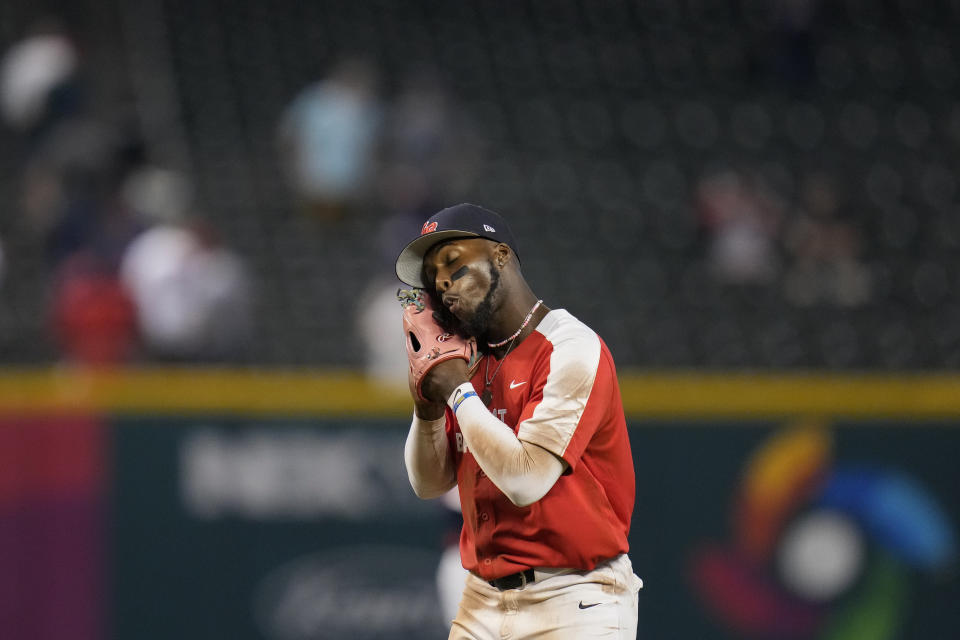 Great Britain's Chavez Young reacts as he runs off the field after his team's victory over Colombia in a World Baseball Classic game in Phoenix, Monday, March 13, 2023. (AP Photo/Godofredo A. Vásquez)