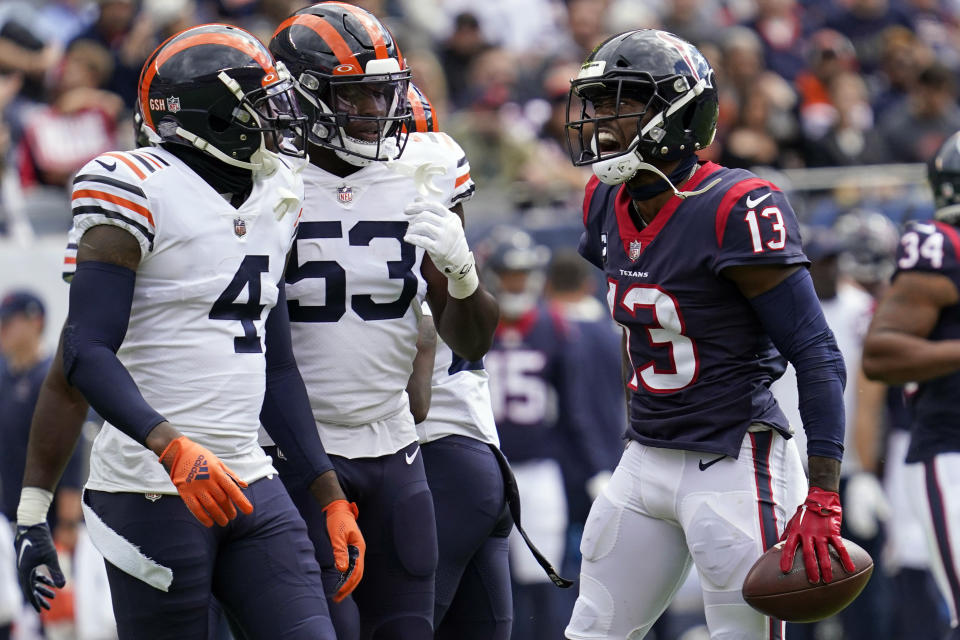 Houston Texans wide receiver Brandin Cooks (13) yells toward Chicago Bears' Eddie Jackson (4) and Nicholas Morrow (53) during the first half of an NFL football game Sunday, Sept. 25, 2022, in Chicago. (AP Photo/Nam Y. Huh)