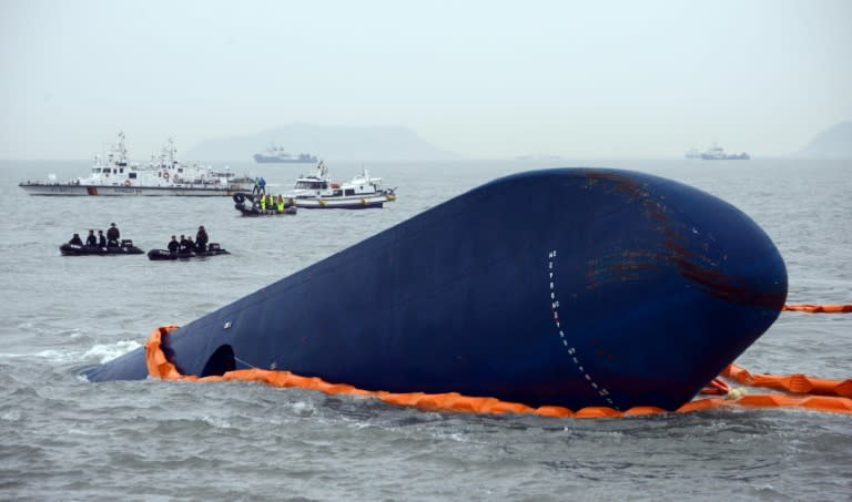 File photo from April 17, 2014 shows the coast guard searching for passengers near the Sewol ferry that capsized on its way to Jeju island killing hundreds of schoolchildren (ED JONES)