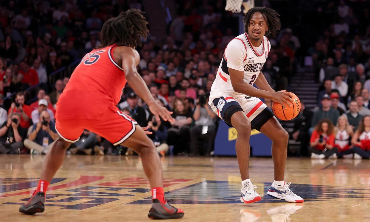 <span>Tristen Newton’s UConn are among the betting favourites at the men’s NCAA Tournament. </span><span>Photograph: Brad Penner/USA Today Sports</span>