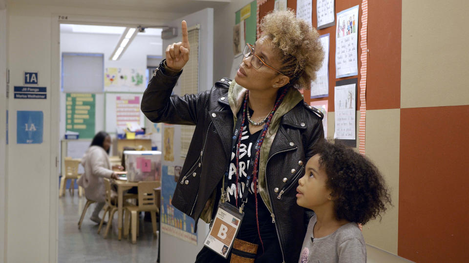 Staceyann picks up her daughter Zuri from school, where she is empowered to write a poem about her hair in A Mother Apart (Courtesy of National Film Board of Canada)