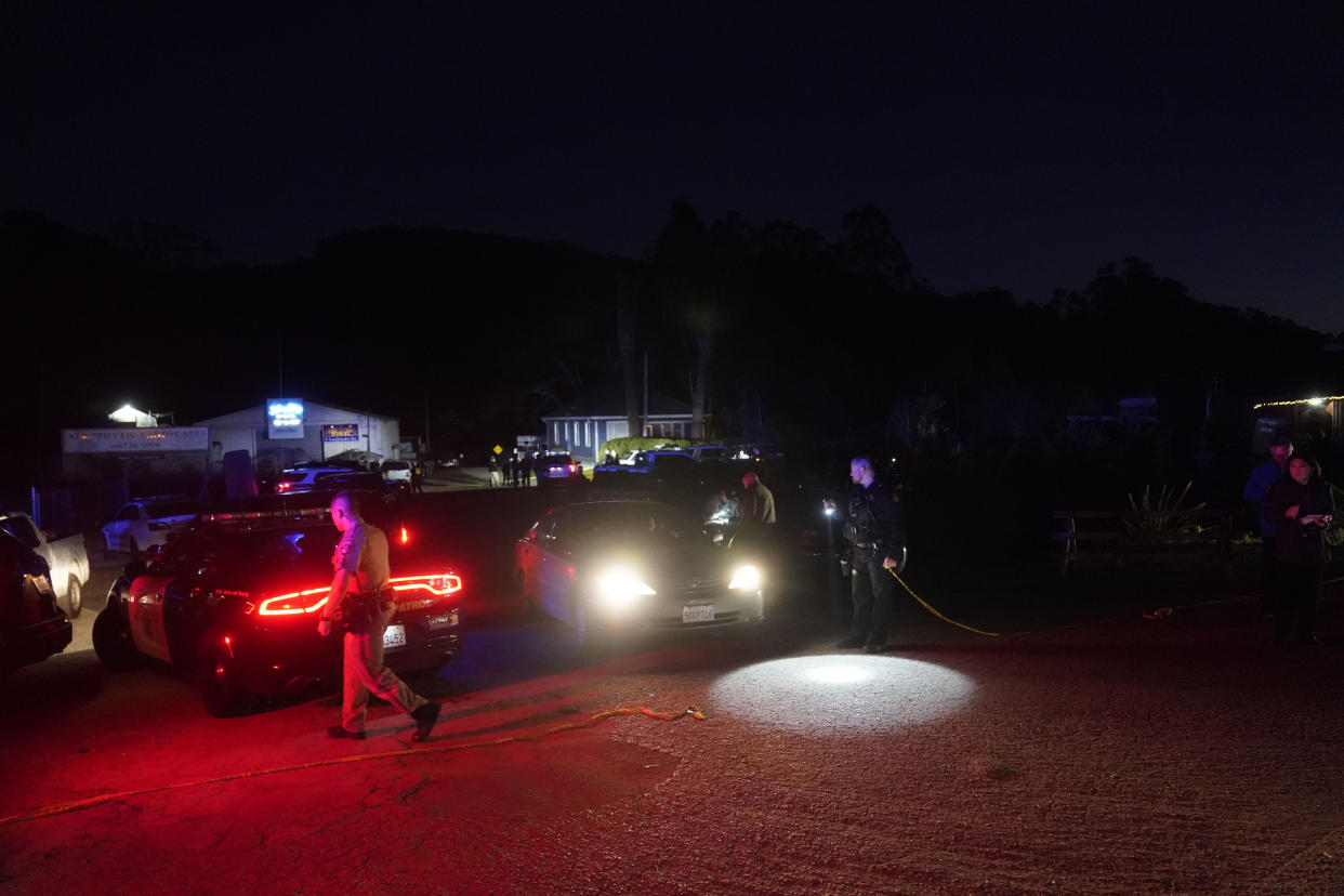 Law enforcement personnel control the scene of a shooting Monday, Jan. 23, 2023, in Half Moon Bay, Calif. Seven people were killed in two related shootings Monday at a mushroom farm and a trucking firm in a coastal community south of San Francisco, and officials say a suspect is in custody. (AP Photo/Jeff Chiu)