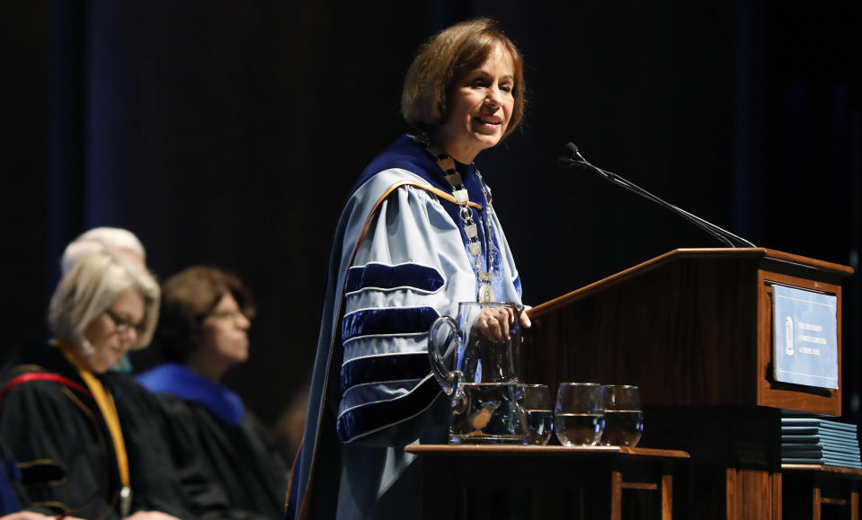 FILE-In this Friday, Oct. 12, 2018 file photo, UNC Chapel Hill Chancellor Carol Folt speaks during University Day at Memorial Hall, in Chapel Hill, N.C. Crews removed remnants of a Confederate statue from North Carolina's flagship public university early Tuesday, Jan 15, 2019, hours after Folt, the school's outgoing chancellor, ordered that the empty pedestal be put into storage because of safety concerns.(Ethan Hyman/The News & Observer via AP, File)