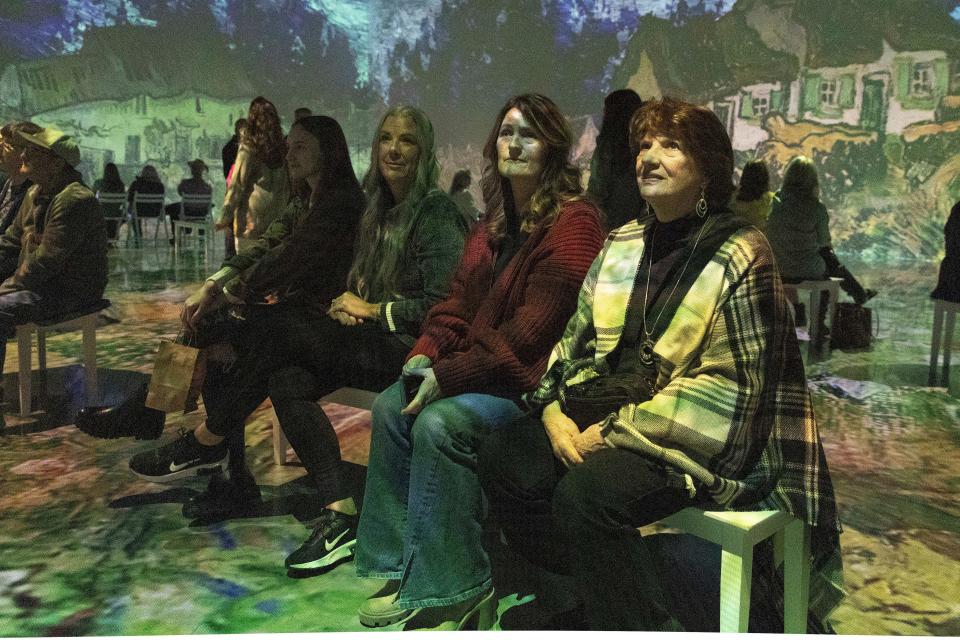 Lenda Barker, Staci Jacobi, Pamela Barker and Hannah Jacobi, of Marlow, watch the "Immersive Van Gogh" exhibit Dec. 15 at the Oklahoma City Convention Center.