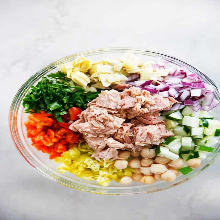 Tuna salad ingredients in a bowl.