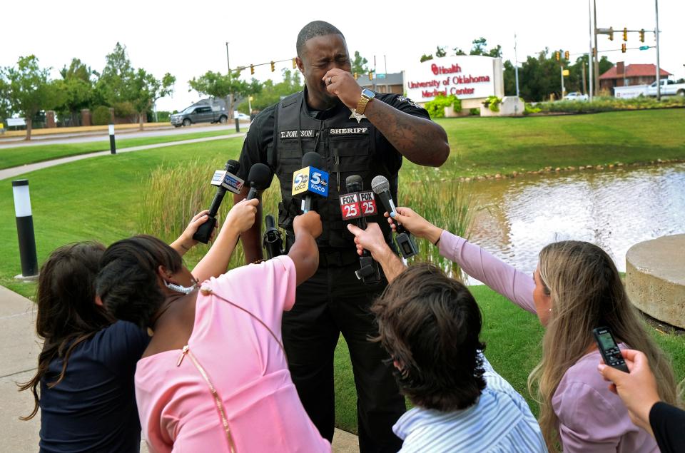 Oklahoma County Sheriff Tommie Johnson III becomes emotional as he briefs the media Monday at OU Medical trauma center after two deputies were shot in south Oklahoma City.