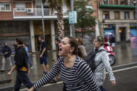 <p>A woman shouts during clashes with Spanish police officers outside the Ramon Llull polling station in Barcelona Oct. 1, 2017 during a referendum on independence for Catalonia banned by Madrid. (Photo: Fabio Bucciarelli/AFP/Getty Images) </p>