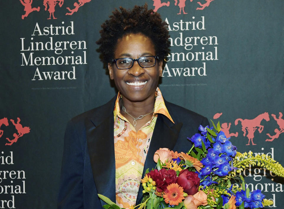 FILE - Author Jacqueline Woodson, laureate of the 2018 Astrid Lindgren Memorial Award (ALMA) poses for photographers after an award ceremony at the Stockholm Concert Hall, in Stockholm on May 28, 2018. In 2021 conservatives pushed to restrict the books permitted in classrooms, like Woodson's "Red at the Bone" and "Brown Girl Dreaming," at a time activists were working to expand them. (Jessica Gow/TT News Agency via AP)