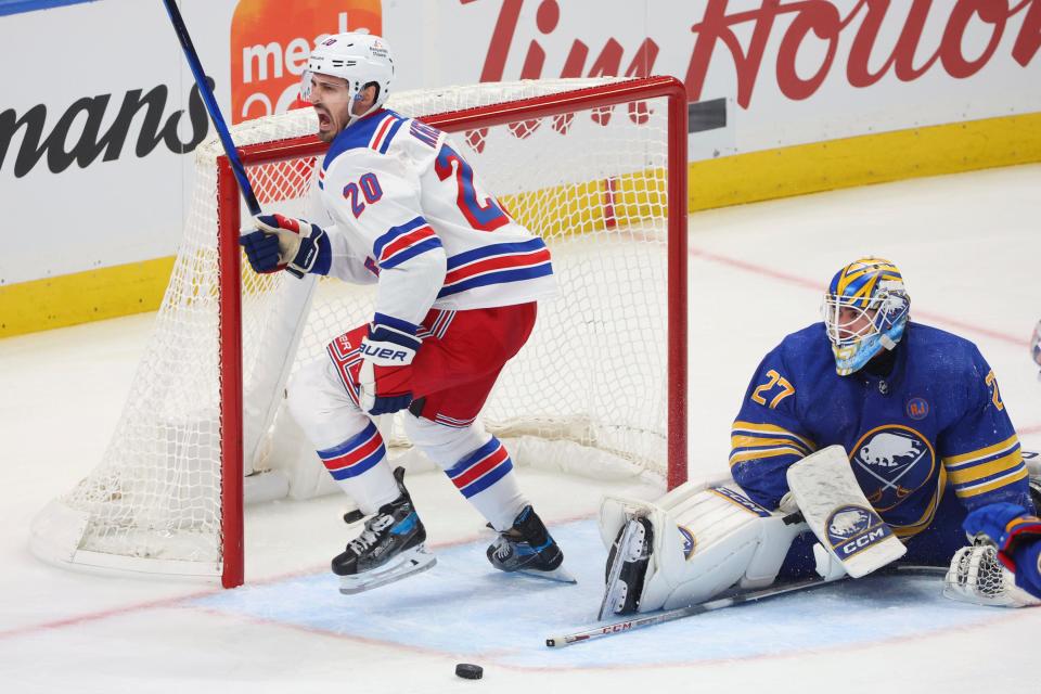 New York Rangers left wing Chris Kreider (20) celebrates after putting the puck past Buffalo Sabres goaltender Devon Levi (27) during the third period of an NHL hockey game Thursday, Oct, 12, 2023, in Buffalo, N.Y.