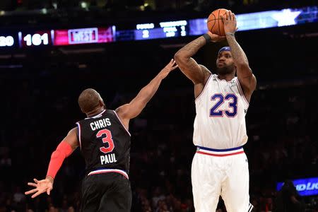 February 15, 2015; New York, NY, USA; Eastern Conference forward LeBron James of the Cleveland Cavaliers (23) shoots against Western Conference guard Chris Paul of the Los Angeles Clippers (3) during the second half of the 2015 NBA All-Star Game at Madison Square Garden. The West defeated the East 163-158. Mandatory Credit: Bob Donnan-USA TODAY Sports