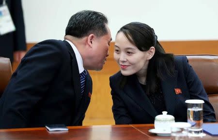 Ri Son-kwon, chairman of the Committee for the Peaceful Reunification of the Fatherland whispers to Kim Yo-Jong, the sister of North Korea's leader Kim Jong-un before their meeting at the Presidential Blue House in Seoul, South Korea, February 10, 2018. Yonhap via REUTERS