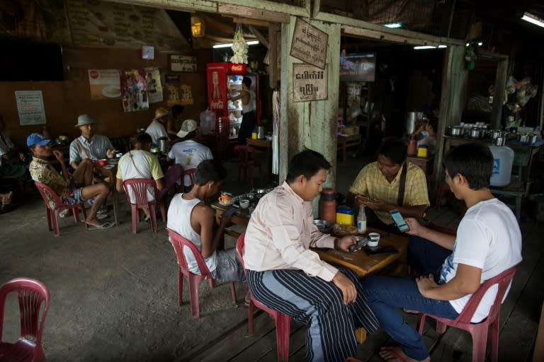 Myanmar people gather for refreshement at a teashop in Yangon