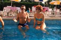 <p>Regis Philbin and his wife Joy enjoy a hotel swimming pool in 1989. </p>