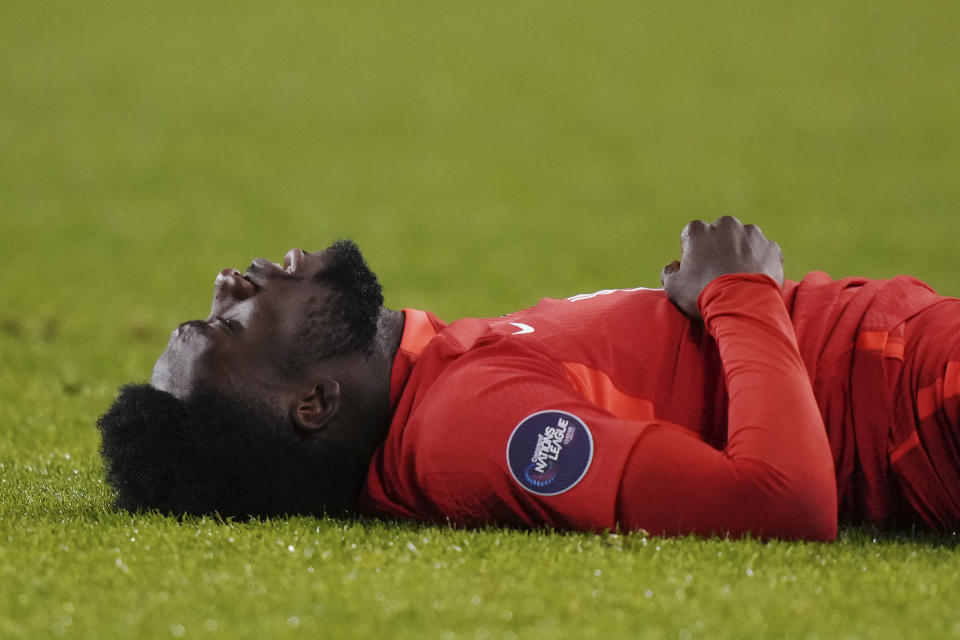 Canada's Alphonso Davies reacts during the first half in the second leg of the team's CONCACAF Nations League soccer quarterfinal against Jamaica in Toronto on Tuesday, Nov. 21, 2023. (Chris Young/The Canadian Press via AP)