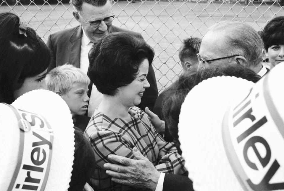 In this Oct. 21, 1967, file photo, Shirley Temple Black, on the campaign trial for the U.S. Senate, was the center of attention as she moved through a public park and talked with people of her district in San Mateo, Calif. Temple, who died at her home near San Francisco, Monday, Feb. 10, 2014, at 85, sang, danced, sobbed and grinned her way into the hearts of Depression-era moviegoers and remains the ultimate child star decades later. (AP Photo/ Robert Klein, File)