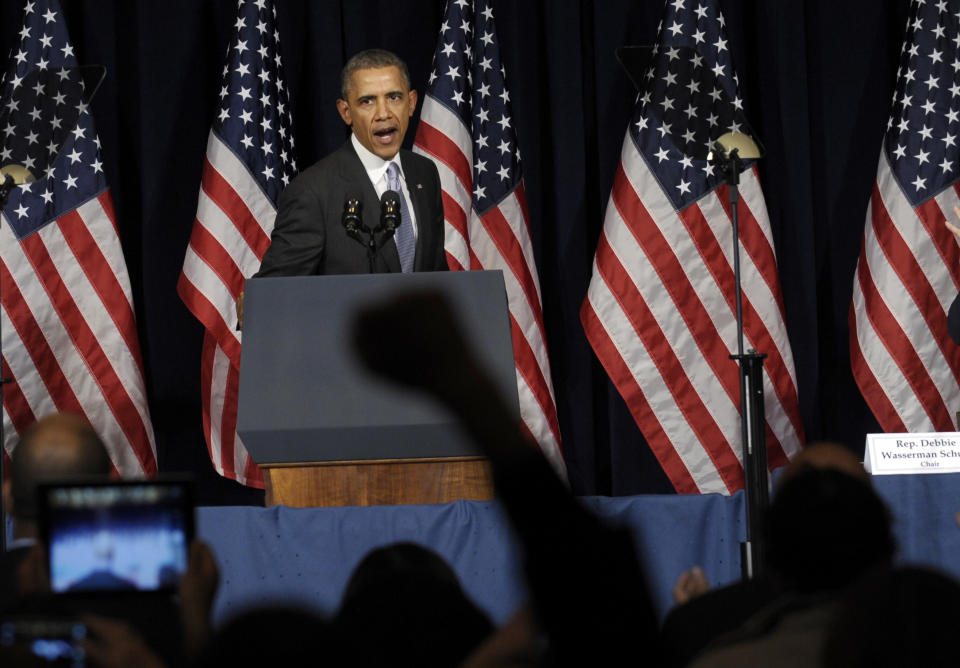 President Barack Obama speaks at the Democratic National Committee Winter Meeting in Washington, Friday, Feb. 28, 2014. (AP Photo/Susan Walsh)