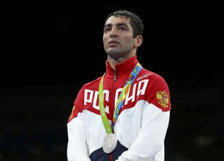 2016 Rio Olympics - Boxing - Victory Ceremony - Men's Fly (52kg) Victory Ceremony - Riocentro - Pavilion 6 - Rio de Janeiro, Brazil - 21/08/2016. Silver medallist Misha Aloian (RUS) of Russia reacts. REUTERS/Peter Cziborra