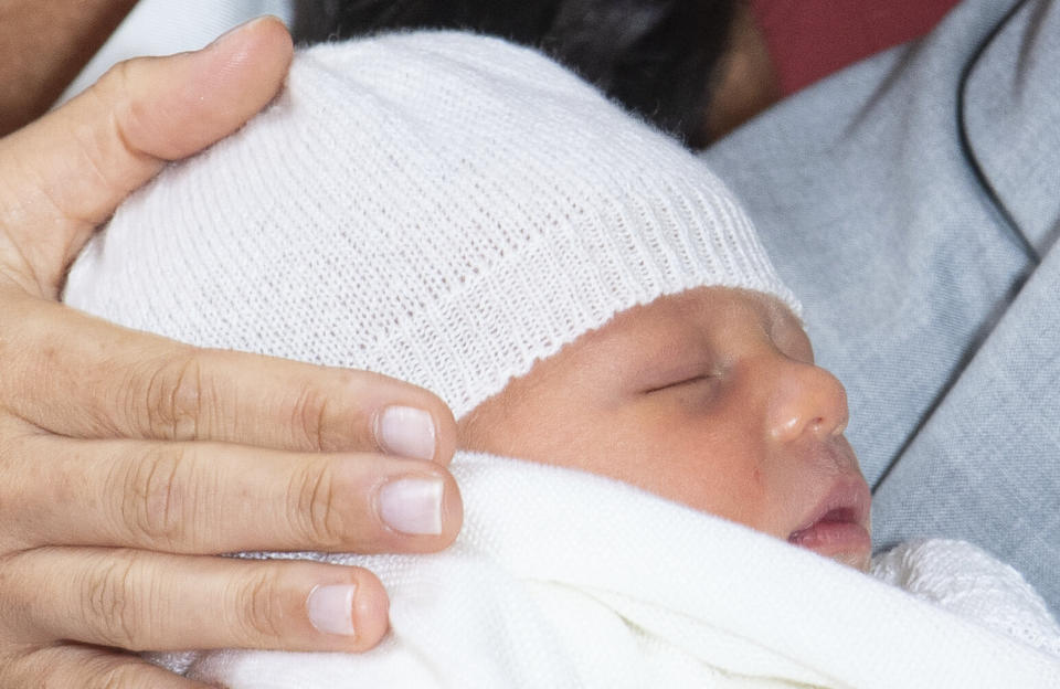 Britain's Prince Harry and Meghan, Duchess of Sussex, during a photocall with their newborn son, in St George's Hall at Windsor Castle, Windsor, south England, Wednesday May 8, 2019. Baby Sussex was born Monday at 5:26 a.m. (0426 GMT; 12:26 a.m. EDT) at an as-yet-undisclosed location. An overjoyed Harry said he and Meghan are "thinking" about names. (Dominic Lipinski/Pool via AP)