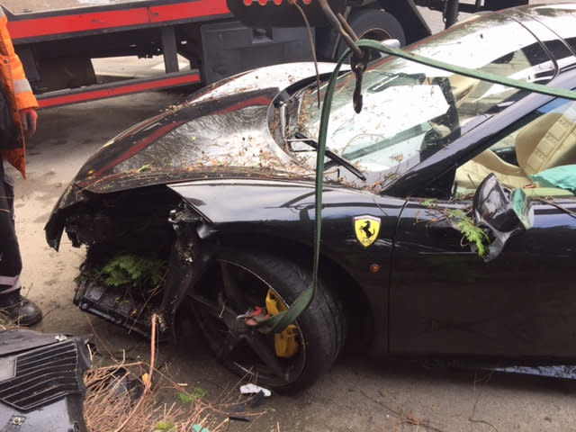 The £200,000 Ferrari hit a house (SWNS)