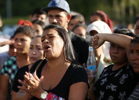 Relatives of inmates react in front of a prison complex in the Brazilian state of Amazonas after prisoners were found strangled to death in four separate jails, according to the penitentiary department in Manaus, Brazil May 27, 2019. REUTERS/Bruno Kelly