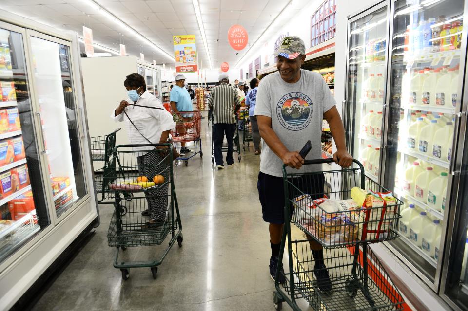 The Piggly Wiggly store held an opening ceremony in Spartanburg on Aug. 24, 2022. Shoppers look for products in the new store. 