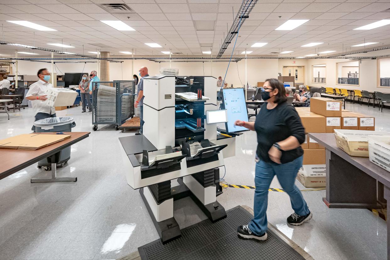 Ballots are counted at the Maricopa County Election Department 