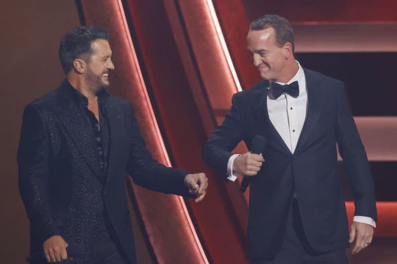 Country singer Luke Bryan and retired NFL legend Peyton Manning co-host the 57th Annual CMA Awards at Bridgestone Arena in Nashville on Wednesday. Photo by John Angelillo/UPI