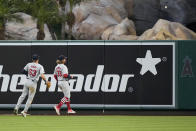 St. Louis Cardinals' Michael Siani, left, and Brendan Donovan watch a ball hit by Los Angeles Angels' Logan O'Hoppe go out for a three-run home run during the fourth inning of a baseball game Tuesday, May 14, 2024, in Anaheim, Calif. (AP Photo/Mark J. Terrill)