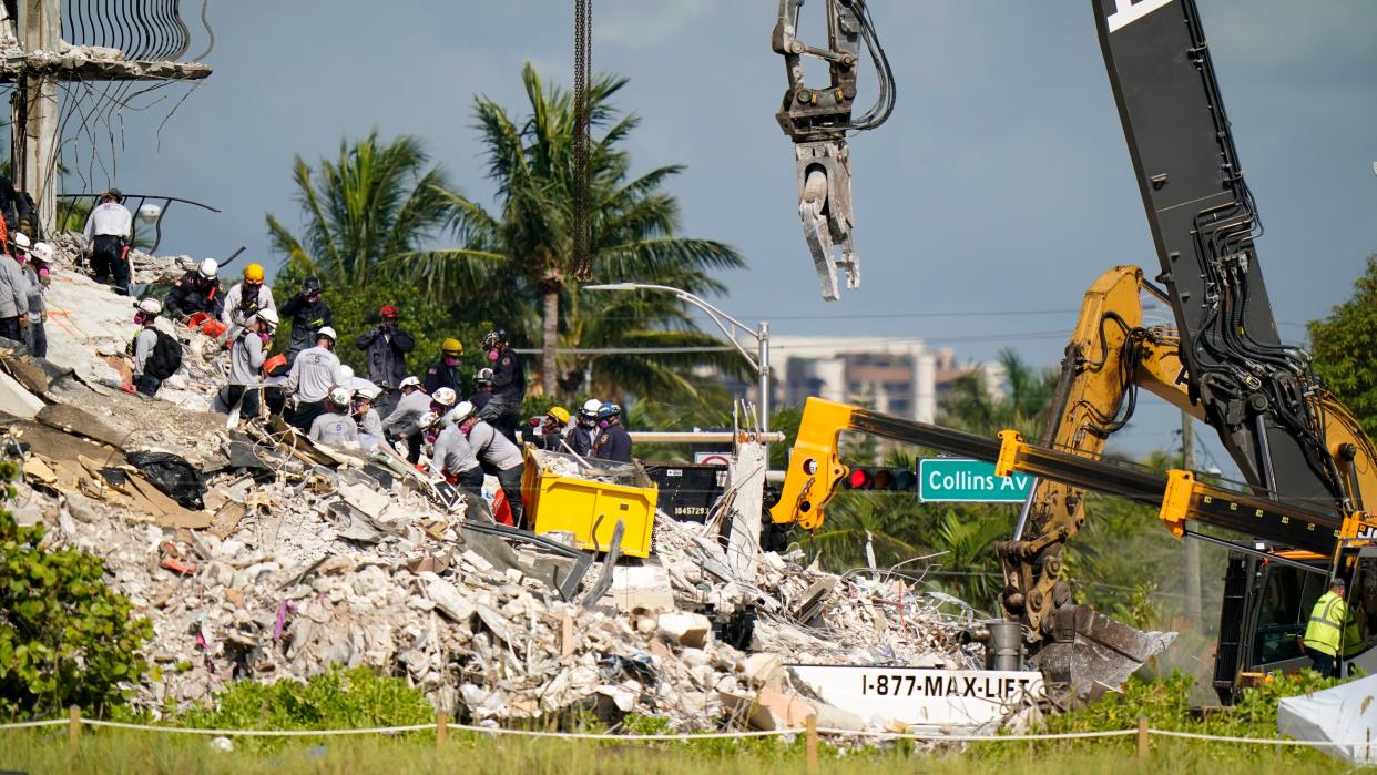 Workers search the rubble at the Champlain Towers South Condo on Monday, June 28, 2021, in Surfside, Fla.