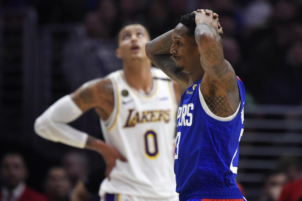 Los Angeles guard Lou Williams, with his hands on his head.