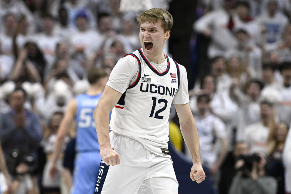 UConn guard Cam Spencer (12) reacts in the first half of an NCAA college basketball game against Creighton, Wednesday, Jan. 17, 2024, in Stores, Conn. (AP Photo/Jessica Hill)