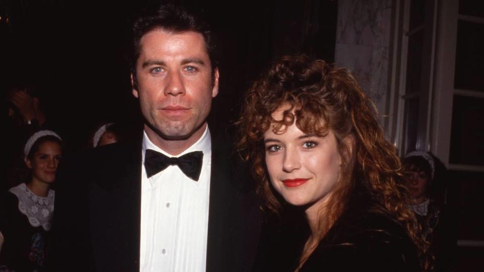 Man and woman smiling; John Travolta young