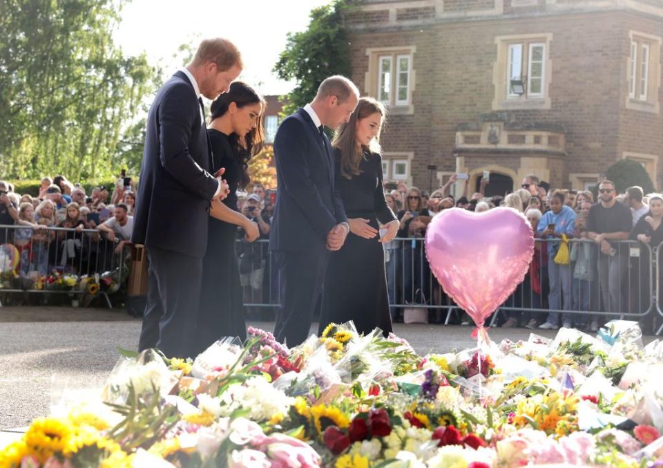 the prince and princess of wales accompanied by the duke and duchess of sussex greet wellwishers outside windsor castle