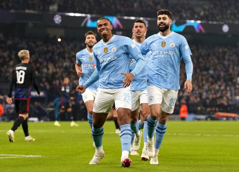Manchester City's Manuel Akanji (L) celebrates scoring his side's first goal with teammates during the UEFA Champions League round of 16 second leg soccer match between Manchester City and FC Copenhagen at the Etihad Stadium. Nick Potts/PA Wire/dpa