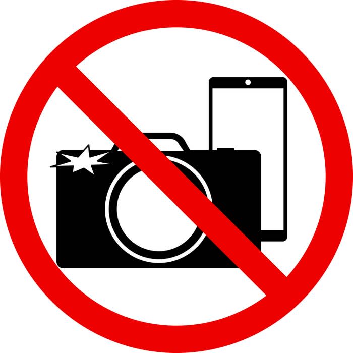 "No photos allowed" sign