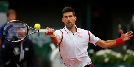 Tennis - French Open - Roland Garros - Novak Djokovic of Serbia v Roberto Bautista Agut of Spain - Paris, France - 31/05/16. Djokovic returns the ball. REUTERS/Gonzalo Fuentes