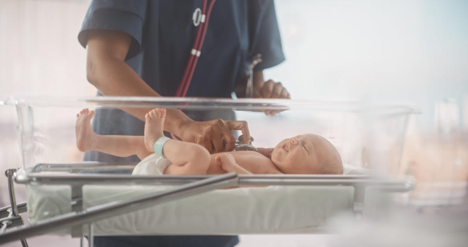 Young Doctor Does Checkup in Nursery