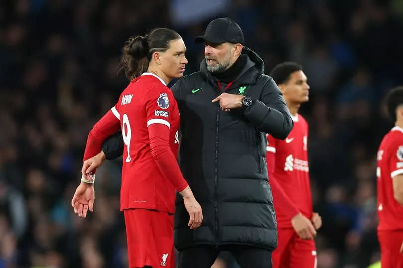 LIVERPOOL, ENGLAND - APRIL 24: Jurgen Klopp the head coach / manager of Liverpool consoles a dejected Darwin Nunez of Liverpool after his teams 2-0 loss during the Premier League match between Everton FC and Liverpool FC at Goodison Park on April 24, 2024 in Liverpool, England.(Photo by Robbie Jay Barratt - AMA/Getty Images)