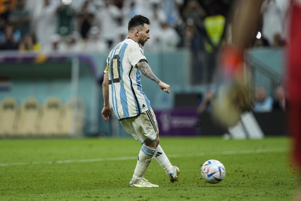 Argentina's Lionel Messi scores a penalty kick during the World Cup quarterfinal soccer match between the Netherlands and Argentina, at the Lusail Stadium in Lusail, Qatar, Saturday Dec. 10, 2022. (AP Photo/Jorge Saenz)