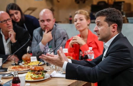 Ukraine's President Volodymyr Zelenskiy holds a press-marathon at a food market in Kiev