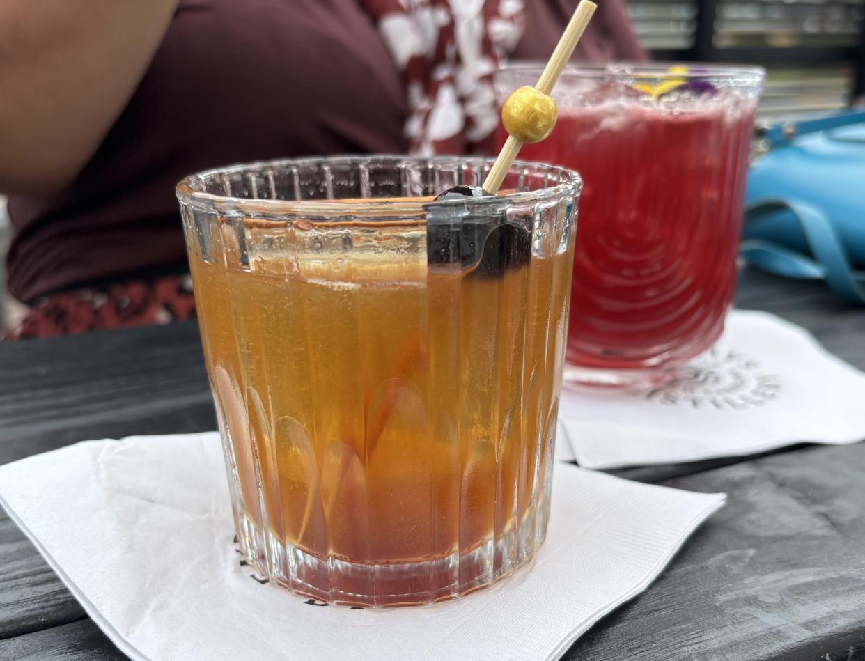 A Manhattan and Sesamo cocktail at End of Days Distillery in Wilmington's Cargo District.