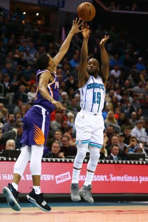 Jan 19, 2019; Charlotte, NC, USA; Charlotte Hornets guard Kemba Walker (15) shoots a three point basket against the Phoenix Suns at Spectrum Center. Mandatory Credit: Jeremy Brevard-USA TODAY Sports