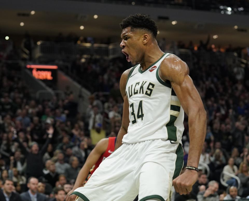 Milwaukee Bucks' Giannis Antetokounmpo reacts after a dunk during the second half of an NBA basketball game against the New Orleans Pelicans Wednesday, Dec. 19, 2018, in Milwaukee. The Bucks won 123-115. (AP Photo/Morry Gash)