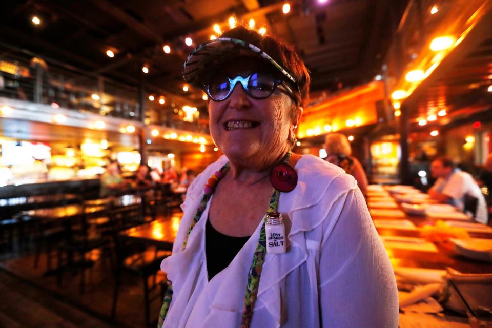Sandy Schwartz, member of The Parrot Head Club of Memphis can be seen at a get-together to honor Jimmy Buffett at Lafayette's Music Room in Memphis, Tenn., on Sept. 4, 2023. She has been to 40 concerts, a political rally, 2 plays, and a book reading involving Buffett.