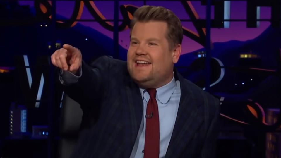  James Corden pointing to audience member on The Late Late Show. 