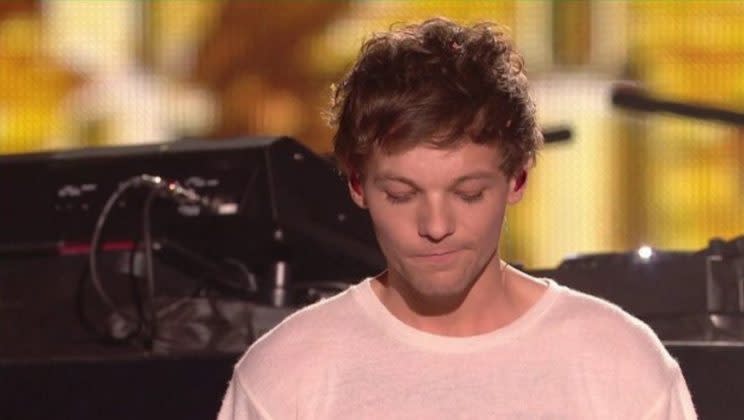 Louis was fighting back tears after making his solo debut.