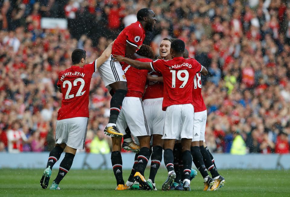 Antonio Valencia s mobbed by his Manchester United teammates after putting the hosts in front at Old Trafford