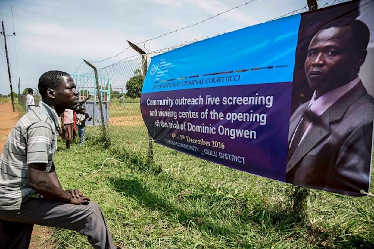 Dominic Ongwen is the first LRA commander to be found guilty of war crimes committed in Northern Uganda. <a href="https://www.gettyimages.com/detail/news-photo/man-looks-at-a-banner-of-former-child-soldier-turned-news-photo/628001270?phrase=dominic%20ongwen&adppopup=true" rel="nofollow noopener" target="_blank" data-ylk="slk:Isaac Kasamani/AFP via Getty Images;elm:context_link;itc:0;sec:content-canvas" class="link ">Isaac Kasamani/AFP via Getty Images</a>